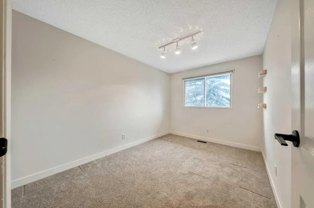 100 Woodfield Green SW Calgary AB T2W 3T9
