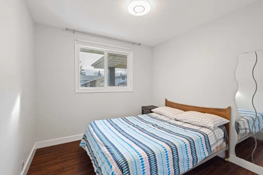208 Woodpark Place SW Calgary AB T2M 2S5