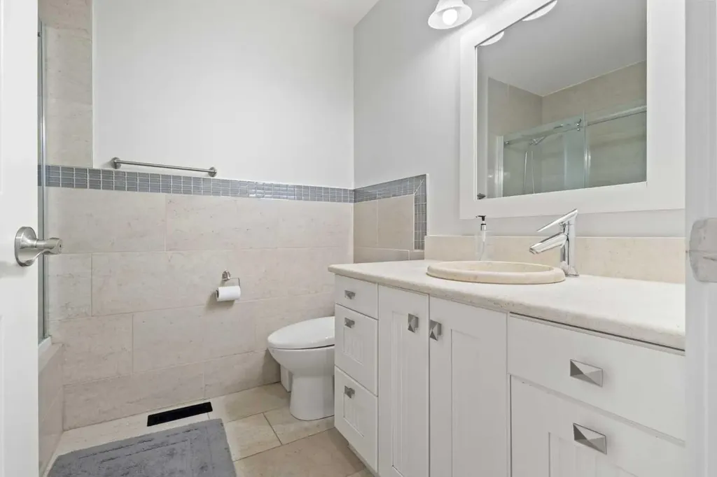 208 Woodpark Place SW Calgary AB T2M 2S5