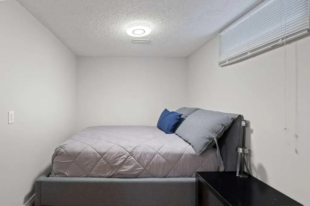 208 Woodpark Place SW Calgary AB T2M 2S5