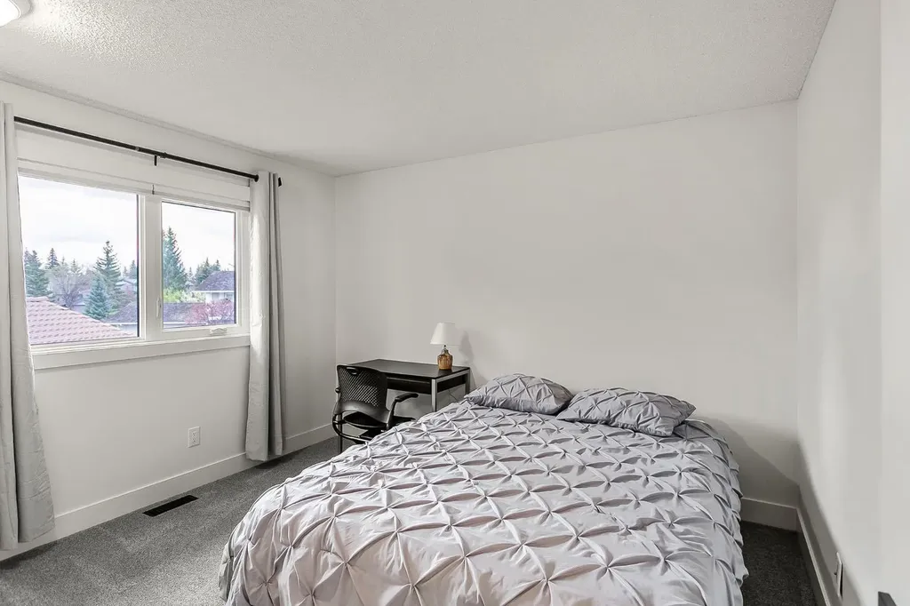 75 Woodacres Crescent SW Calgary AB T2W 4V5