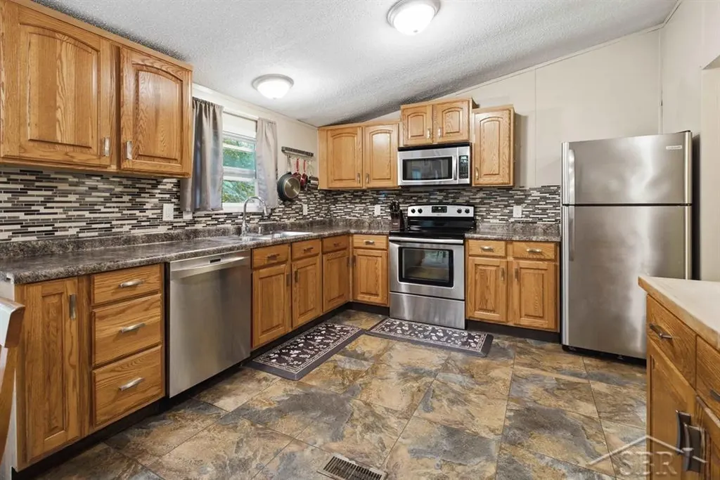 203 W Sampson Drive Jerome Township MI 48657